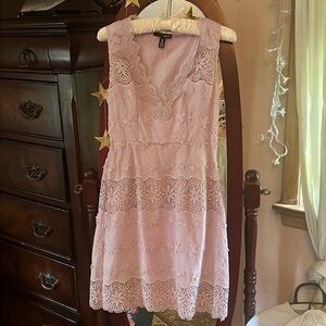 Lavender colored dress. Hits about knee level. Worn only a couple of times.